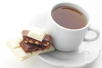 bar of chocolate and tea isolated on white