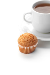 cup of tea and muffin isolated on white