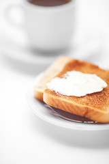 tea and toast with butter isolated on white