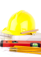 yellow hardhat, tools and construction plans