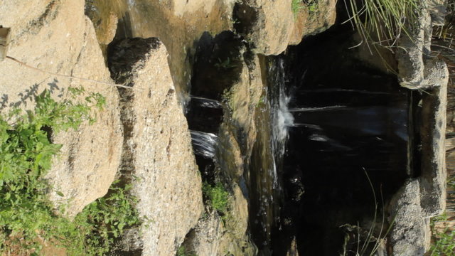Spring waterfall. Vertical shot background