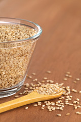 Sesame seeds on small wooden spoon (Selective Focus)