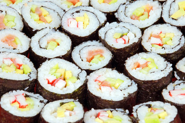 Japanese cuisine - sushi roll with salmon and avocado