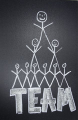 Teamwork team united on chalkboard