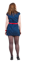 back view of standing beautiful   woman.