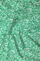 folds of gren and white cloth