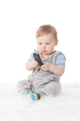 Sweet small baby with mobile phone.