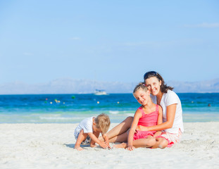 Happy family on tropical beach