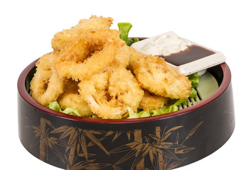 Deep batter fried squid rings calamari with green salad