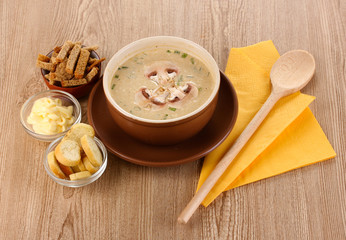 Tasty soup on wooden background