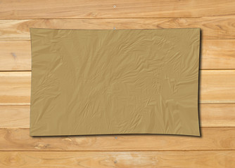 White crumpled paper on wood background