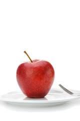 Red apple on plate