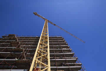 construction site with tower crane - cantiere, gru, cielo blu