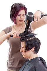 Stylist drying woman hair
