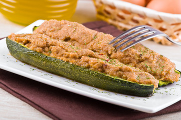 Stuffed zucchini halves.