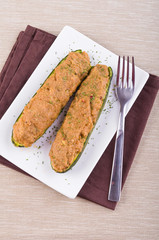 Stuffed zucchini halves.