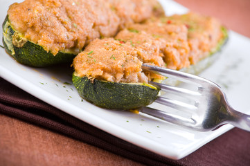 Stuffed zucchini halves.