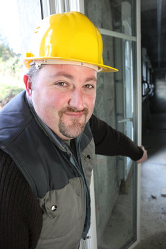 Builder Installing Double Glazing