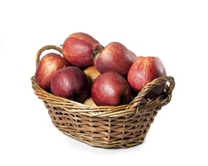 basket of red apples on white background