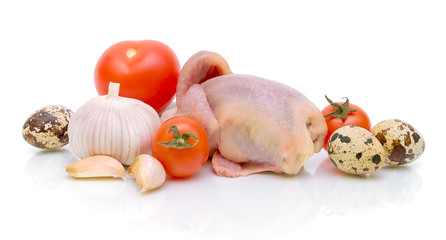 vegetables, eggs and quail carcass on a white background