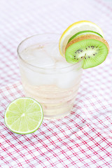 water with lemon and lime,kiwi in a glass with ice
