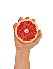 Half of grapefruit in female hand. Isolation.