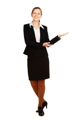 A smiling businesswoman displaying something with her hand