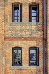 Windows in a red brick wall