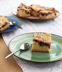 Slices of cake with jam arranged on a plate