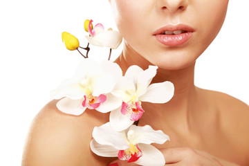 A young woman with orchid, isolated on white