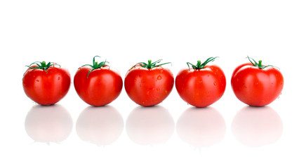 Fresh tomatoes isolated on white