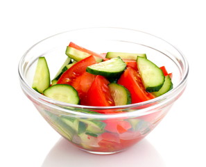 Fresh salad with tomatoes and cucumbers isolated on white