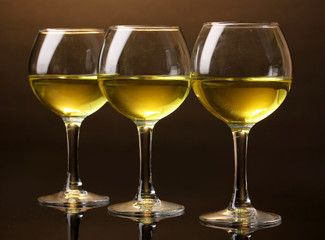 Wineglass on brown background