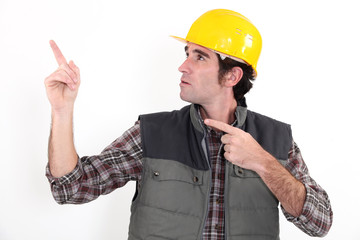 Tradesman pointing upwards