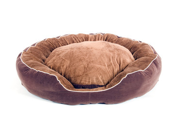 brown fluffy dogbed on white