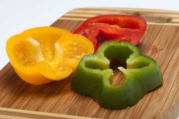 close up of red, yellow and green peppers