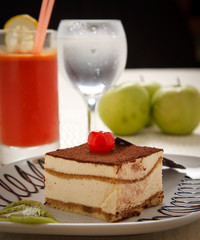 cherry cake witth cream and coffee on top