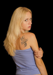 Fototapeta premium Beautiful blond woman with a tattoo
