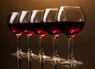 Wineglasses on brown background