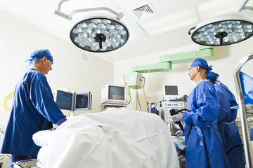 Surgery room with surgeon and nurses