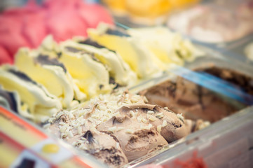 Variety of yummy ice creams under shopping window