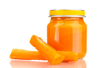 Jar of baby puree with carrot isolated on white