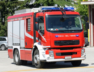 Fototapeta na wymiar fire engine truck running during a mission