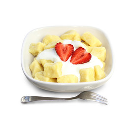 Sweet cottage cheese gnocchi with sour cream and strawberries