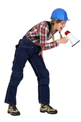 Female construction worker with a megaphone