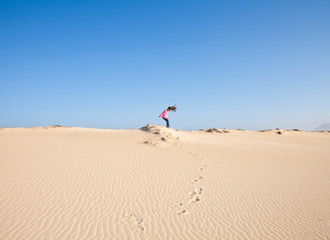 small girl onin dunes