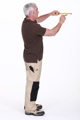 Man drawing line on wall