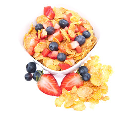 Cornflakes with fresh fruits on white