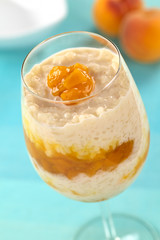Fresh homemade rice pudding with peach compote