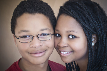Two attractive African American teenagers. One male, one female.